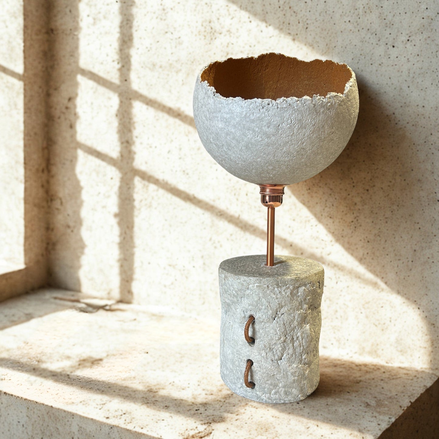 Ceramic vase with textured design on a concrete surface